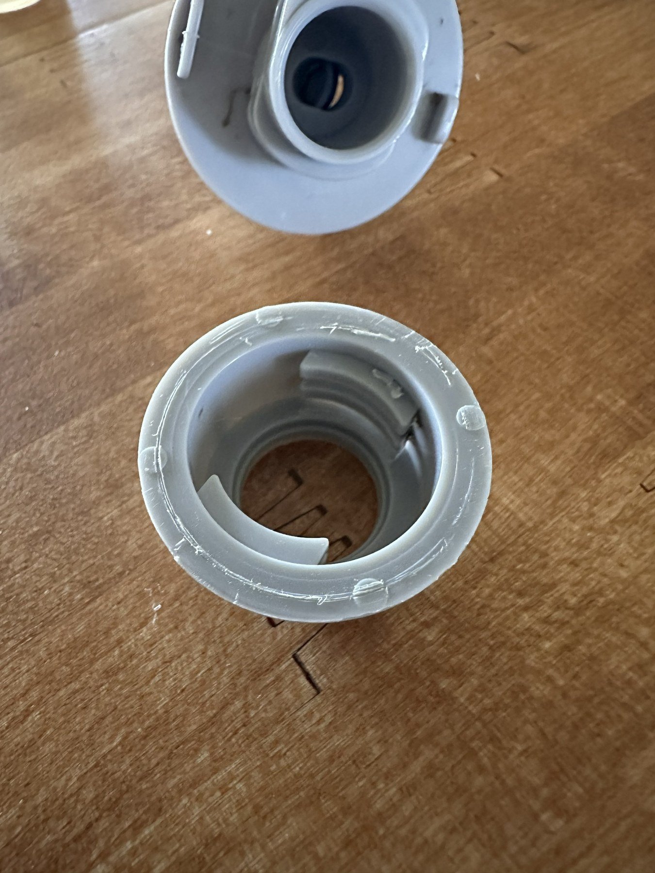 Close view of the gray locking collar with its molded locking ramps