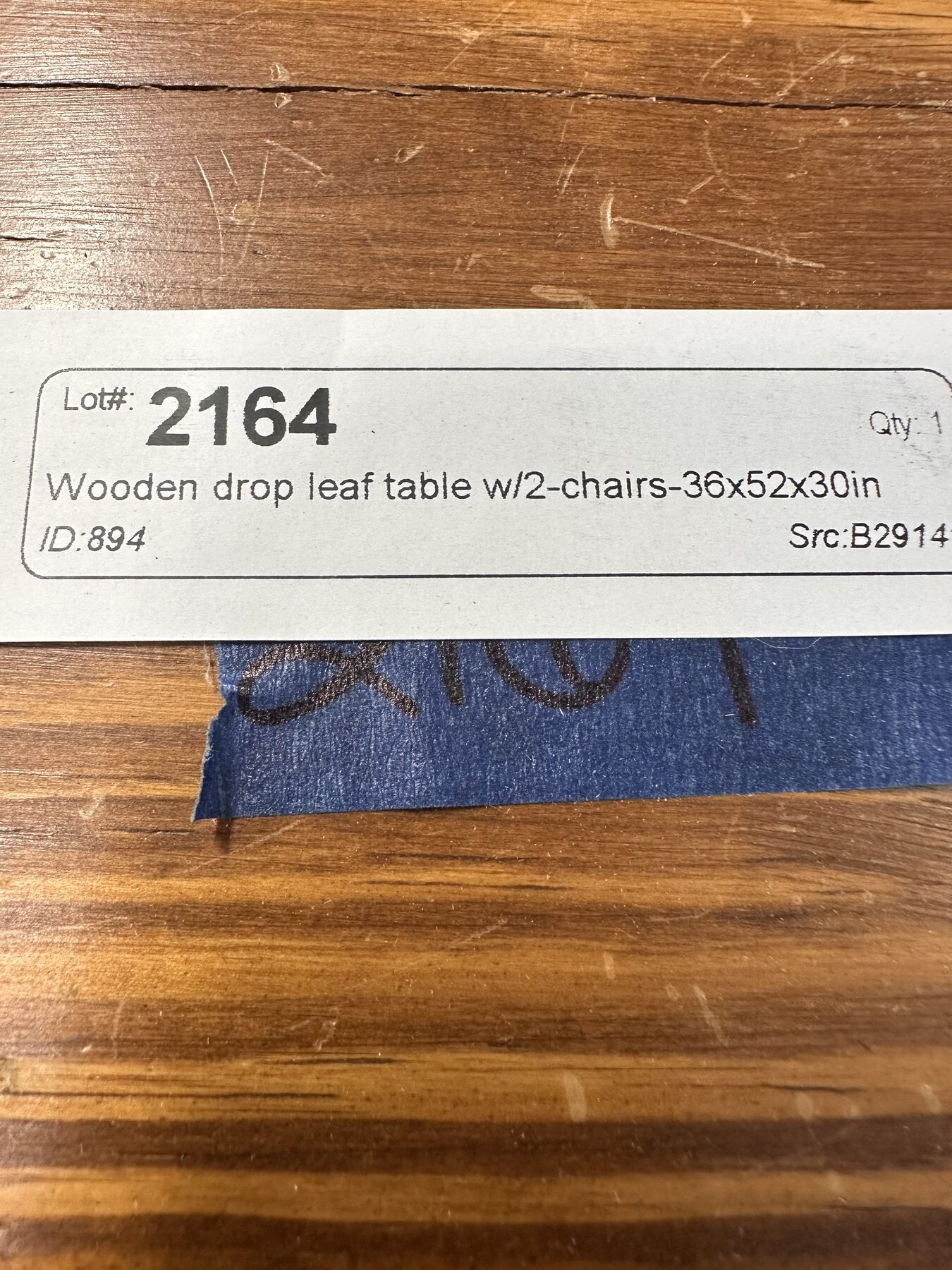 Auction tag identifying lot 2164 as a wooden drop-leaf table with two chairs