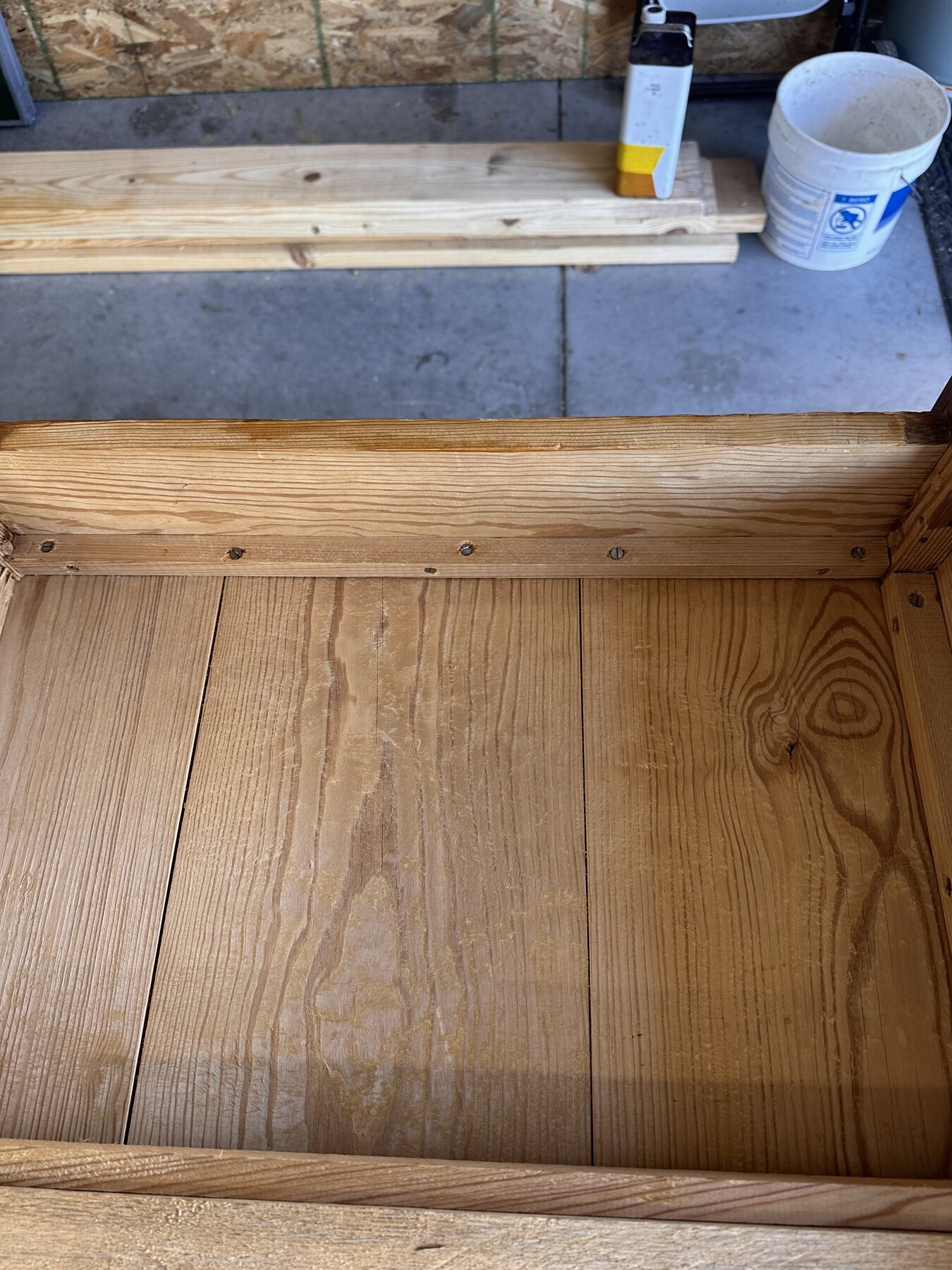 Straight view of several slotted screws along an interior base rail
