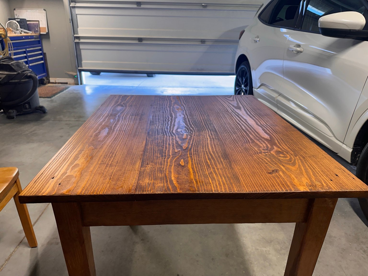 Head-on view across the tabletop after the second polyurethane coat