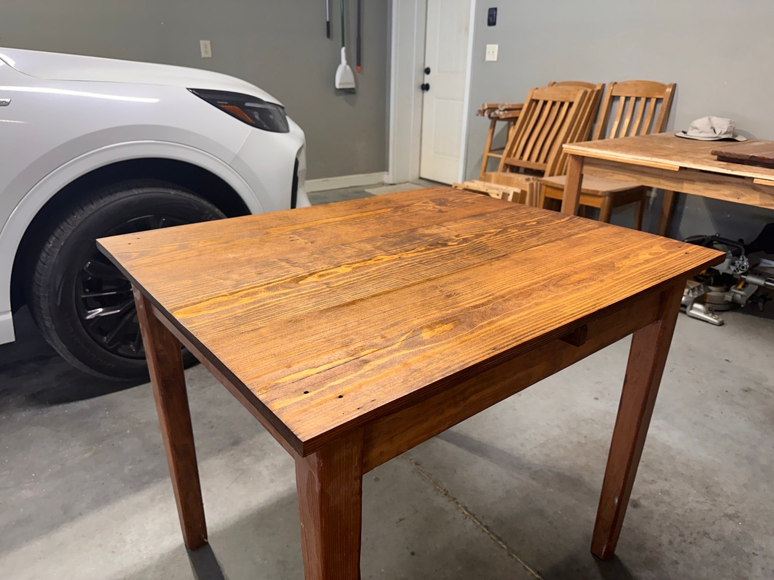 Left-front view of the complete table showing warm grain after polyurethane layer two