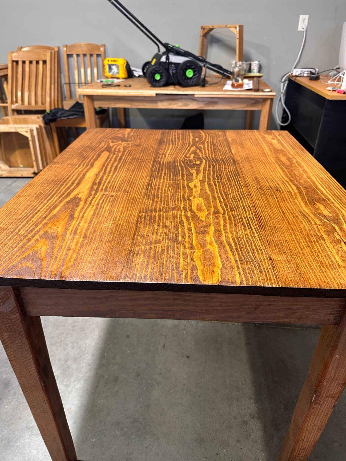 Portrait-oriented front view of the table after its third polyurethane coat