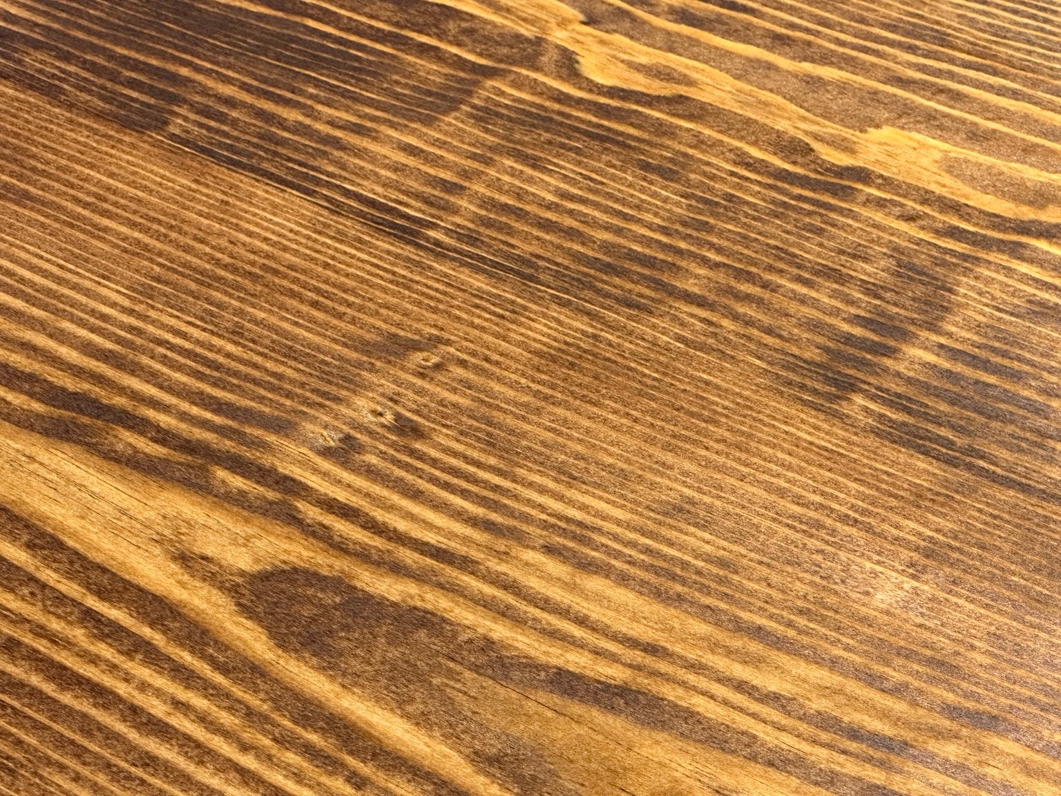 Close surface study of parallel grain and small old marks beneath coat four