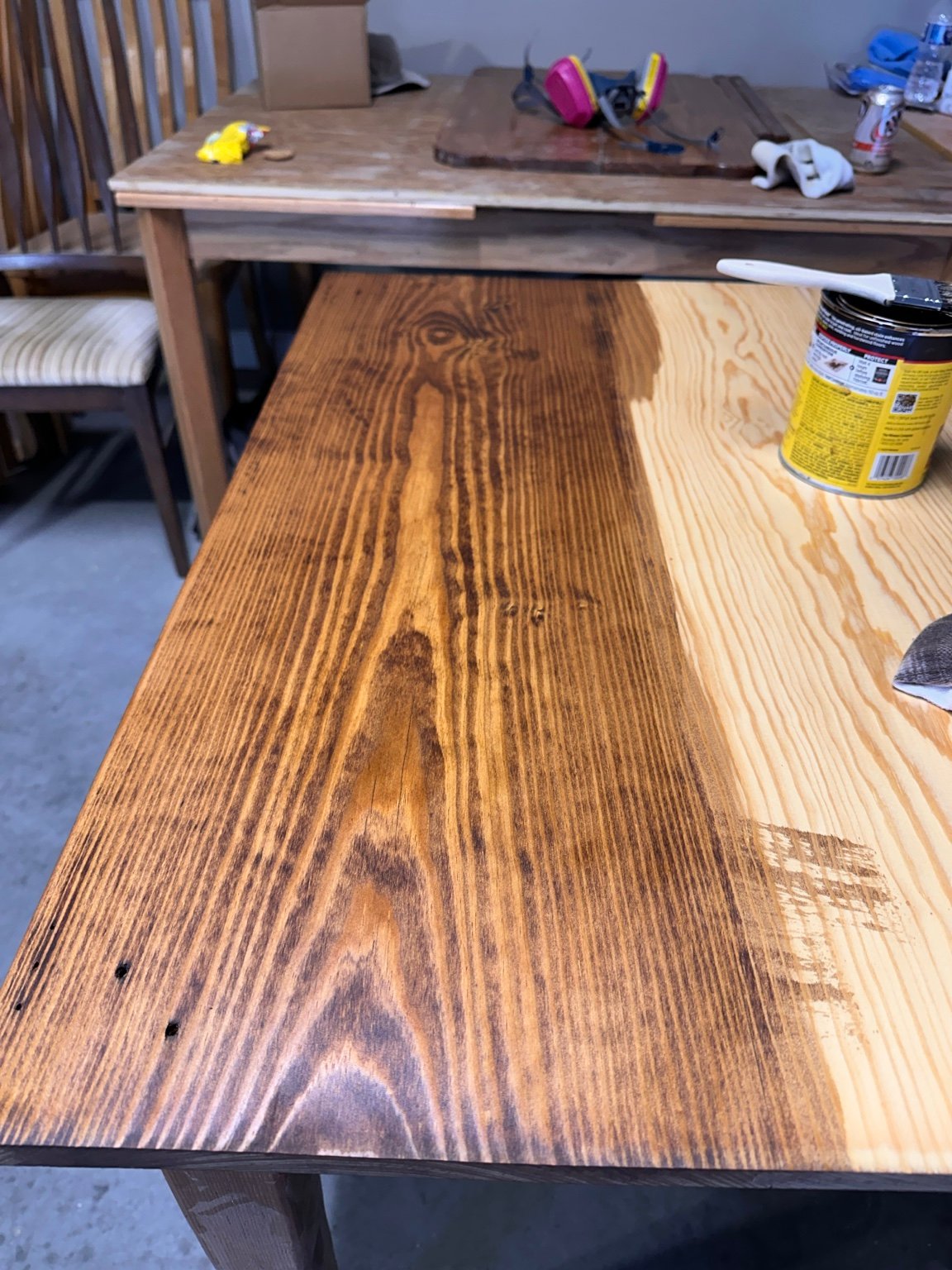 Strong side-by-side contrast between stained and unstained sections of the same tabletop