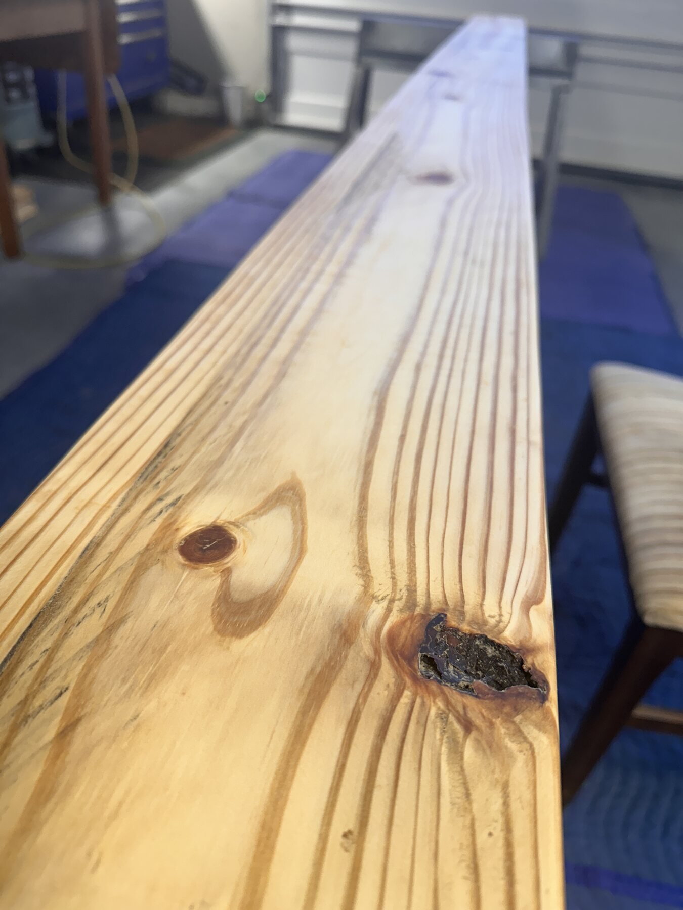 Close-up of pine grain and knots after darker finish