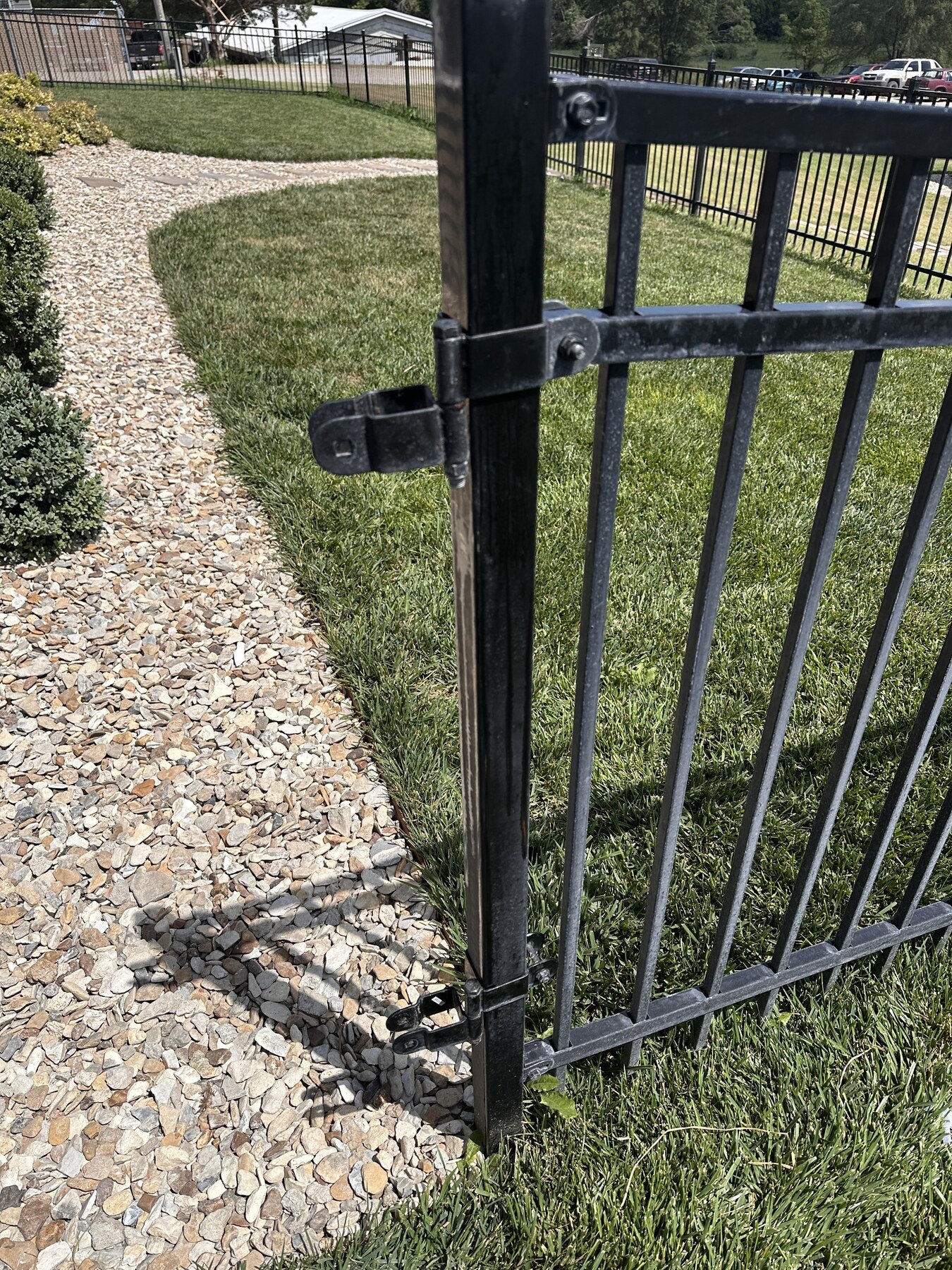 Close view of the black gate hardware during the side reversal