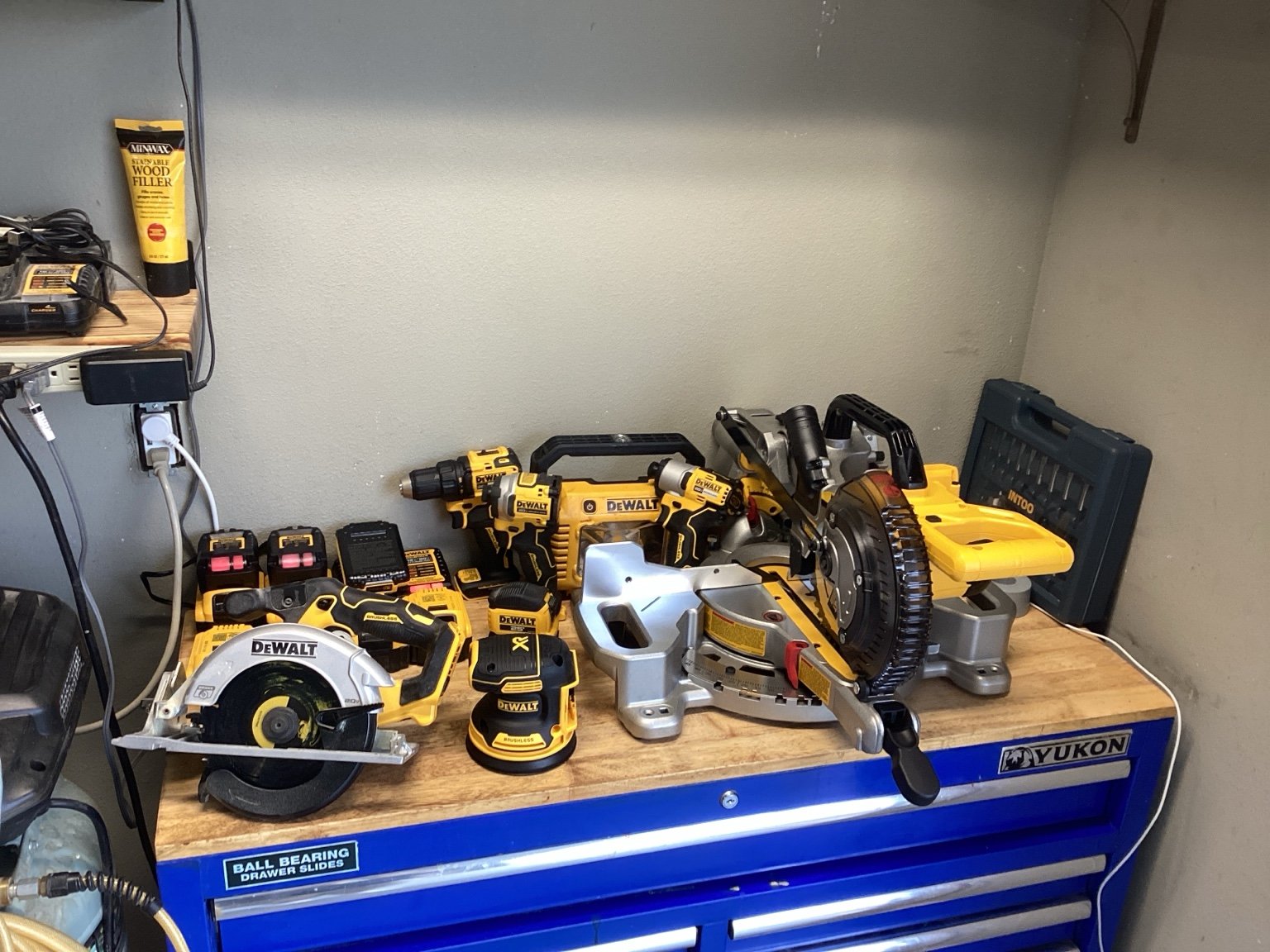 Woodworking tools arranged on Bob's blue Yukon workbench